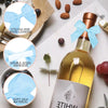 A collection of light blue satin ribbon bows with double-sided adhesive backing and soft silk material shown next to a bottle