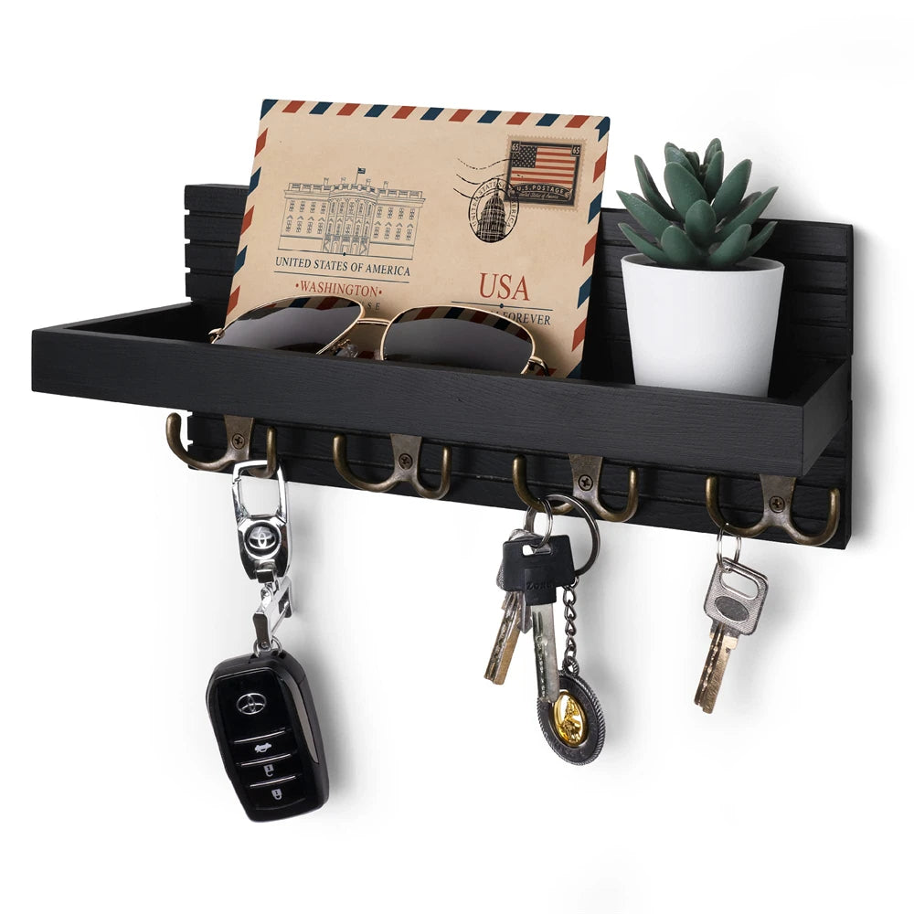 A rustic wooden key holder organizer displaying a USA themed card and various keys.