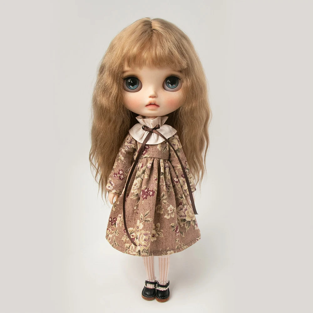 A vintage lace pajama set for a 1/6 doll featuring floral fabric and a ruffled collar.