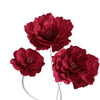 A cluster of deep red velvet artificial peony flowers on a white stem.