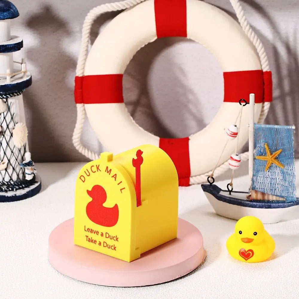 A yellow magnetic duck mailbox cover rests on a pink circular base next to a white life preserver.
