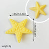 Yellow star-shaped ocean animal cake toppers including a whale, octopus, and turtle set