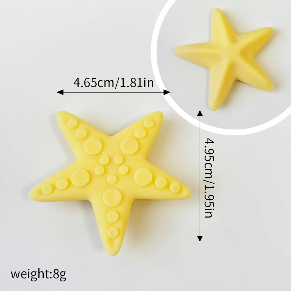 Yellow star-shaped ocean animal cake toppers including a whale, octopus, and turtle set