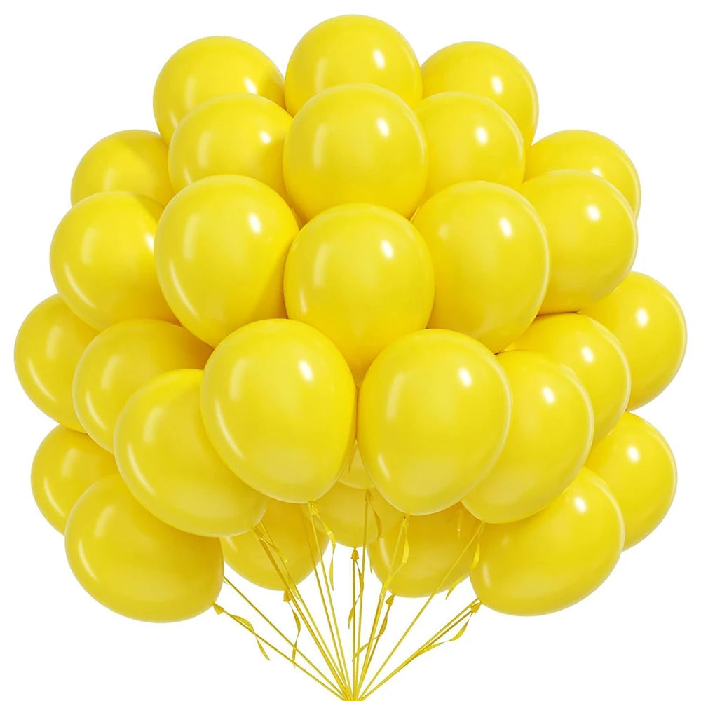 A bunch of bright yellow round latex balloons tied together with a string.