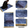 A deep blue velvet prayer rug with intricate geometric patterns and a fringed edge.