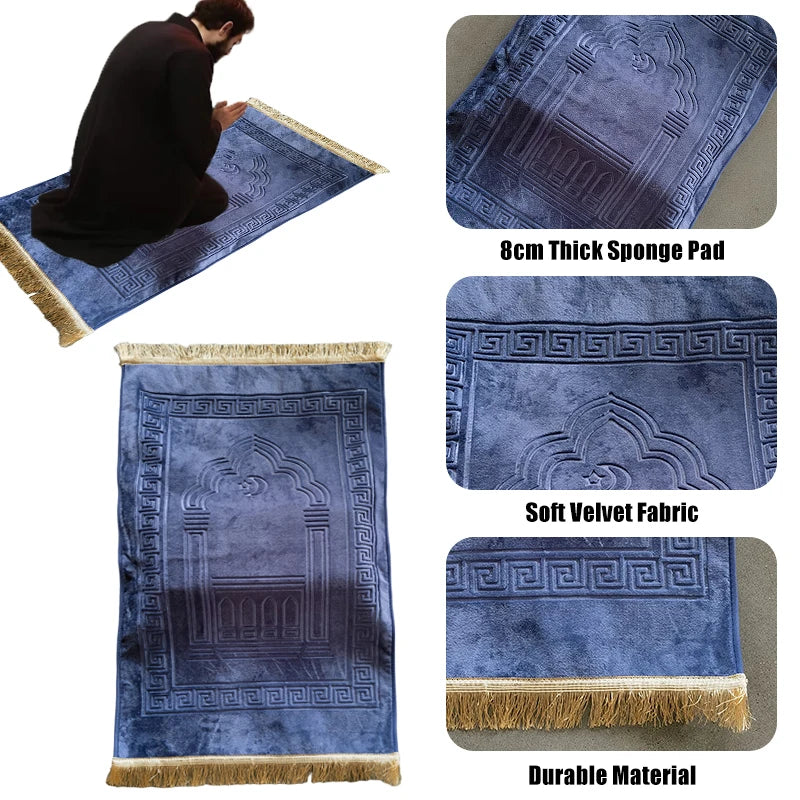 A deep blue velvet prayer rug with intricate geometric patterns and a fringed edge.