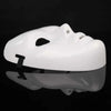 A white performance mask for dance or cosplay, shown from above with a reflective surface.