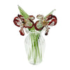 Hand-blown glass flower bouquet featuring deep red and green flowers in a clear glass vase