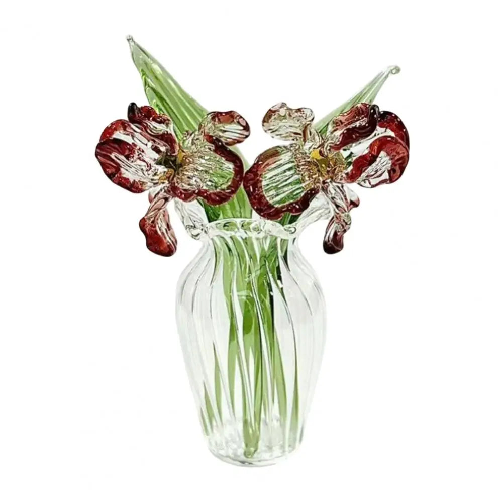 Hand-blown glass flower bouquet featuring deep red and green flowers in a clear glass vase