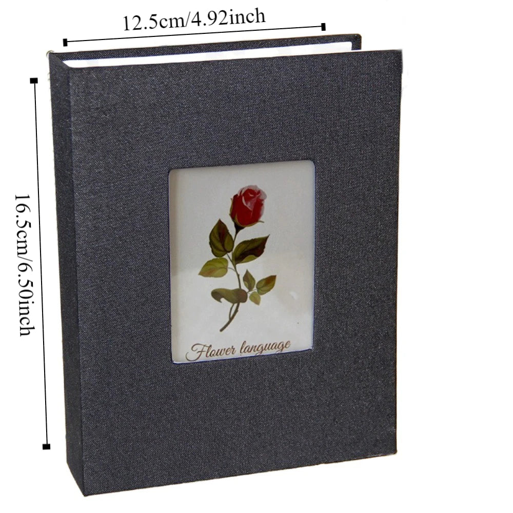 A dark gray linen cover photo album with a square window displaying a red rose and the text Flower language.