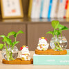 Mini resin desk ornament featuring a green ivy plant and a white lucky cat in a clear glass vase