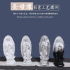 A row of four white and black resin statues depicting Our Lady of Guadalupe.