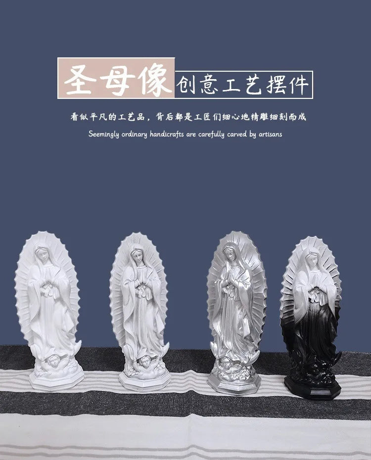 A row of four white and black resin statues depicting Our Lady of Guadalupe.