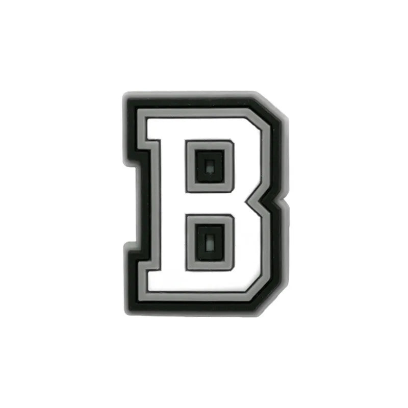 Charm en forme de lettre B, alphabet noir et blanc.