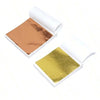 Open package of edible gold leaf flakes for baking and cake decoration showing a sheet of gold color.