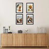 A set of five black wooden picture frames displaying photographs of golden retriever puppies for wall display.