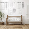 A wall art display showing various aspect ratio grids and a wooden bed frame in a bright room.