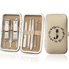 An open leather case displaying an 8-piece stainless steel manicure and pedicure kit with various tools.