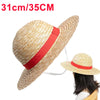A straw hat with a red band is shown, displayed on a hanger.