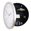 A silver-rimmed watch display box with a black lid showing several gold and silver watches.