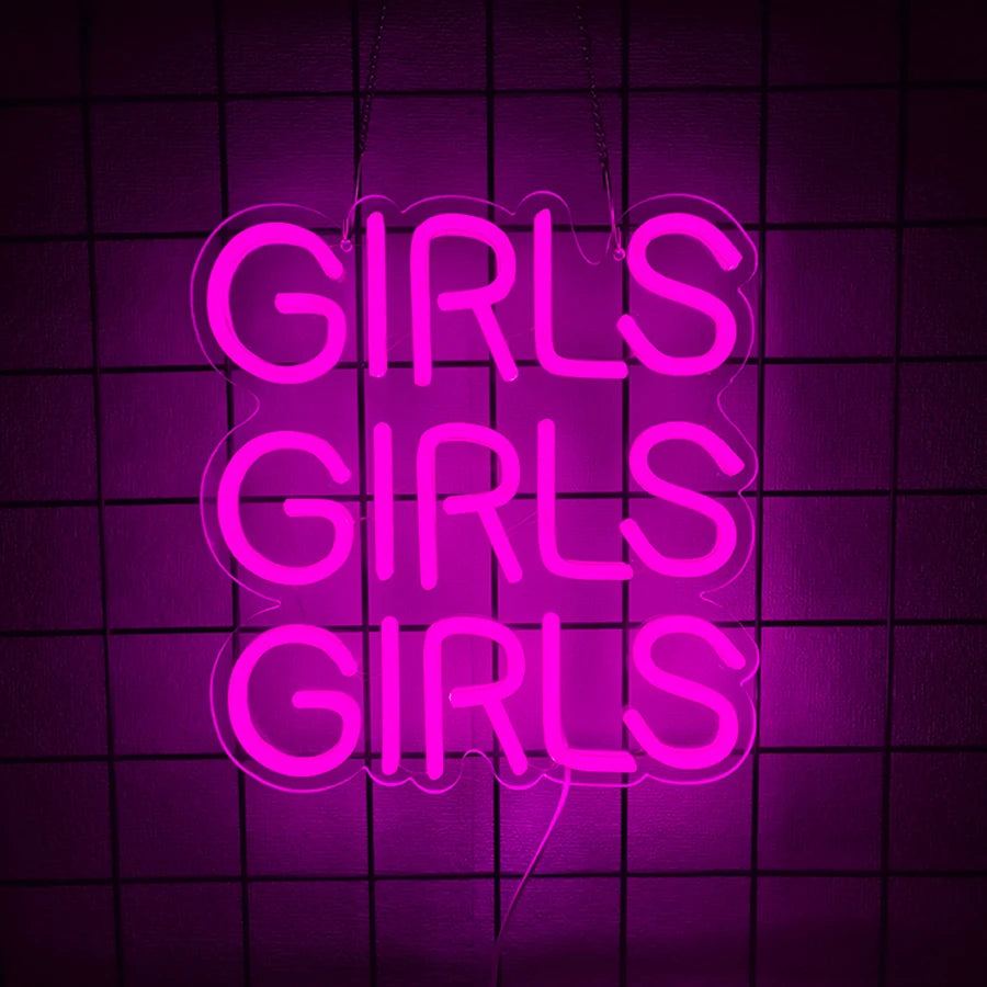 Pink neon sign spelling out GIRLS repeated three times against a dark grid background