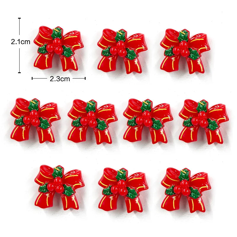 Un juego de imanes navideños rojos y verdes con forma de lazos.