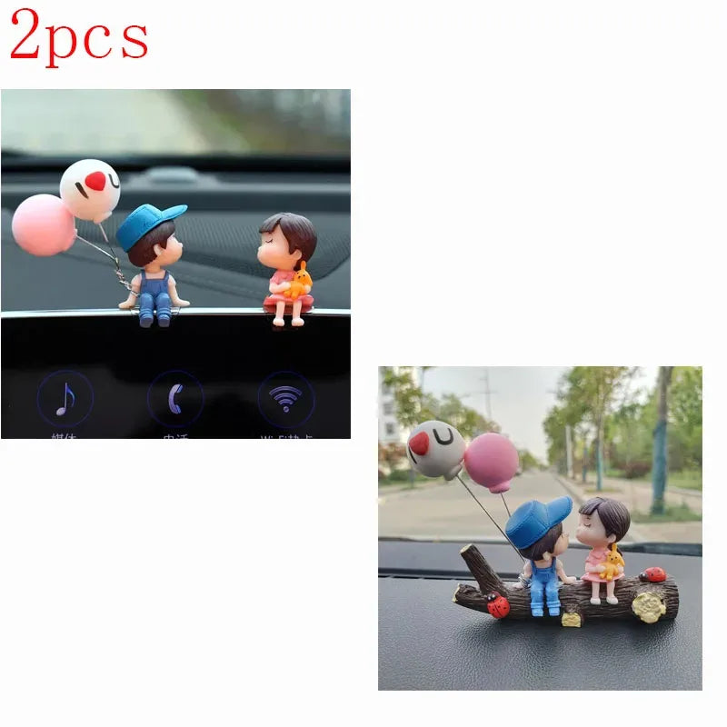 A set of two cute couple balloon car ornaments featuring stylized figures and balloons.