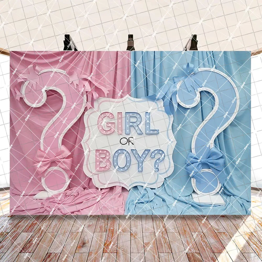 A gender reveal party decoration set featuring pink and blue fabric draping with a girl or boy question mark banner.