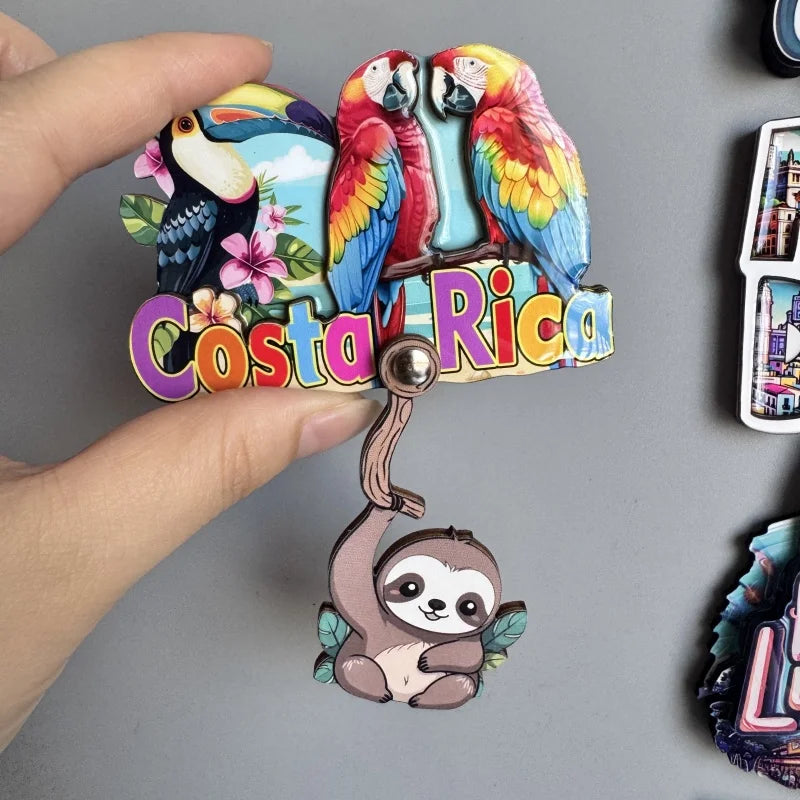 A set of wooden fridge magnets featuring colorful toucans and a sloth, with the text Costa Rica.