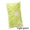 Bag of light green crinkle paper shreds for gift boxes and party decor
