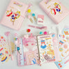 A collection of pink and white luxury heart pendant diary sets featuring decorative paper and accessories.