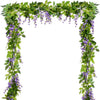 Green silk wisteria vine garland with purple flowers used as a wedding and home decor arch