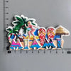 A set of iconic Miami-themed fridge magnets spelling out MIAMI featuring palm leaves and tropical elements.