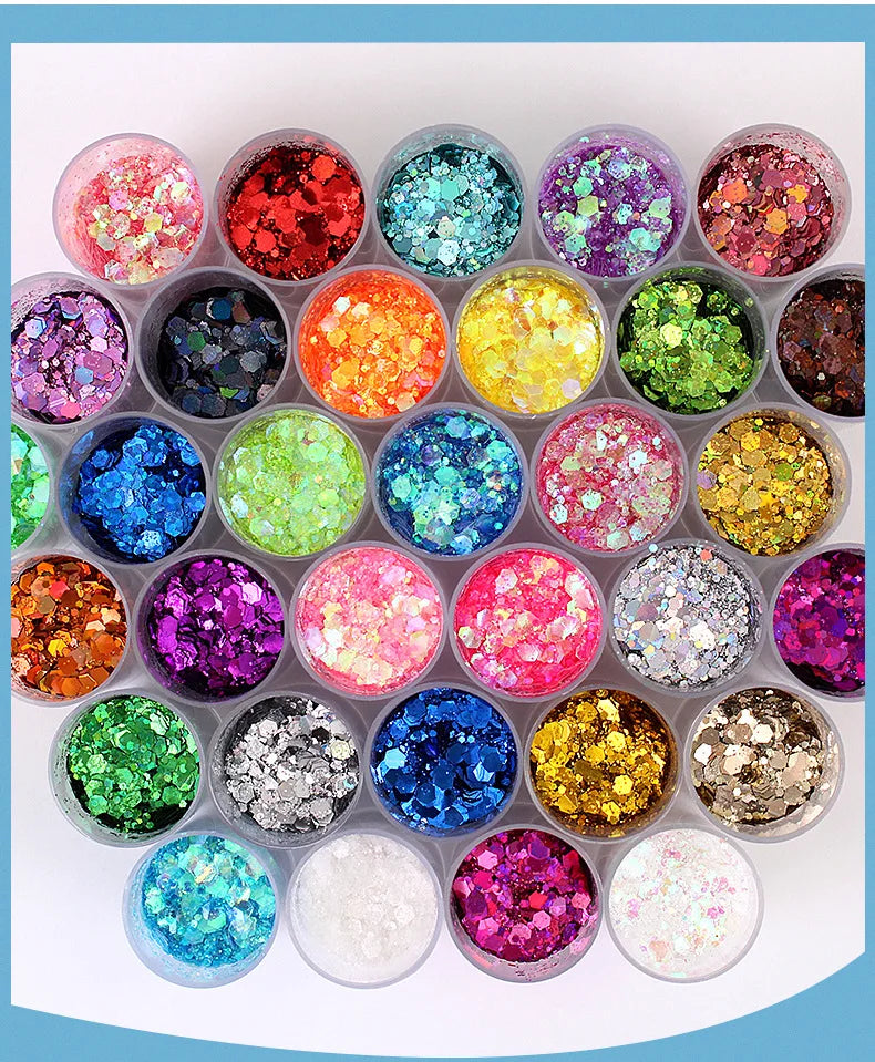 A collection of 32 colorful rainbow glitter mixes in small containers for nail art and DIY crafts.