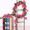 A rustic wooden trellis decorated with a lush garland of pink silk roses for wedding and home decor.