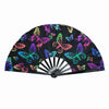 A black folding hand fan decorated with colorful fluorescent UV glow butterfly patterns.