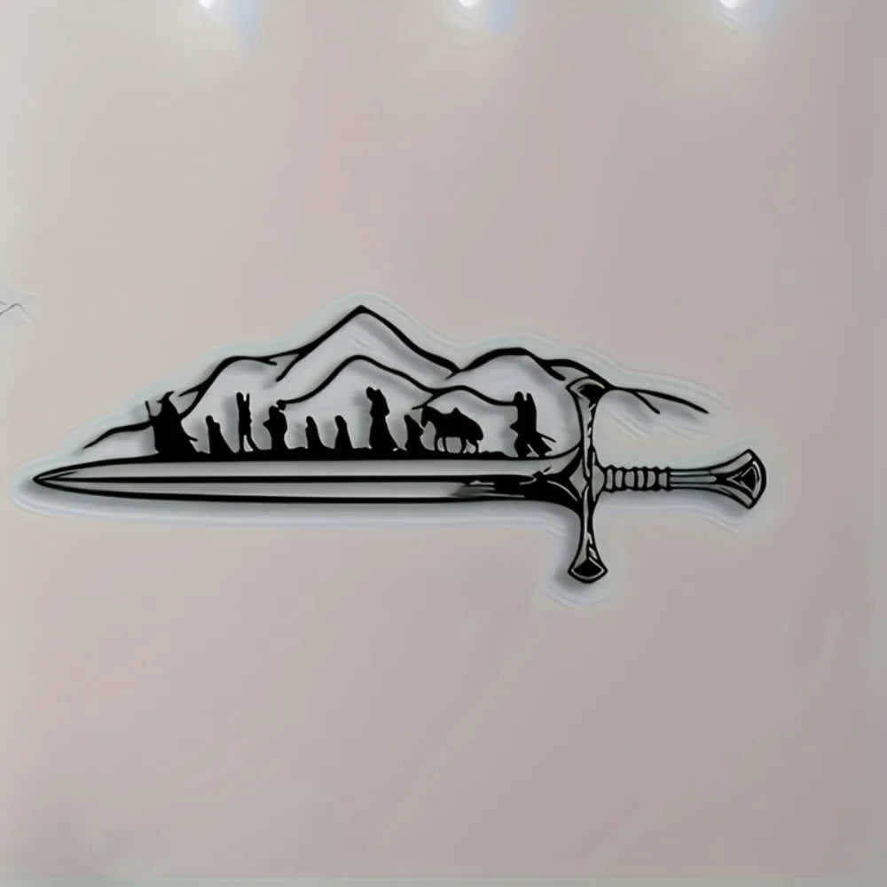 Black silhouette of a sword with a mountain landscape and figures on it.