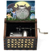 Hand-cranked wooden music box featuring a Totoro design with a large yellow sun in the background.
