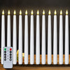 A set of white flameless LED taper candles standing in a row next to a remote control.