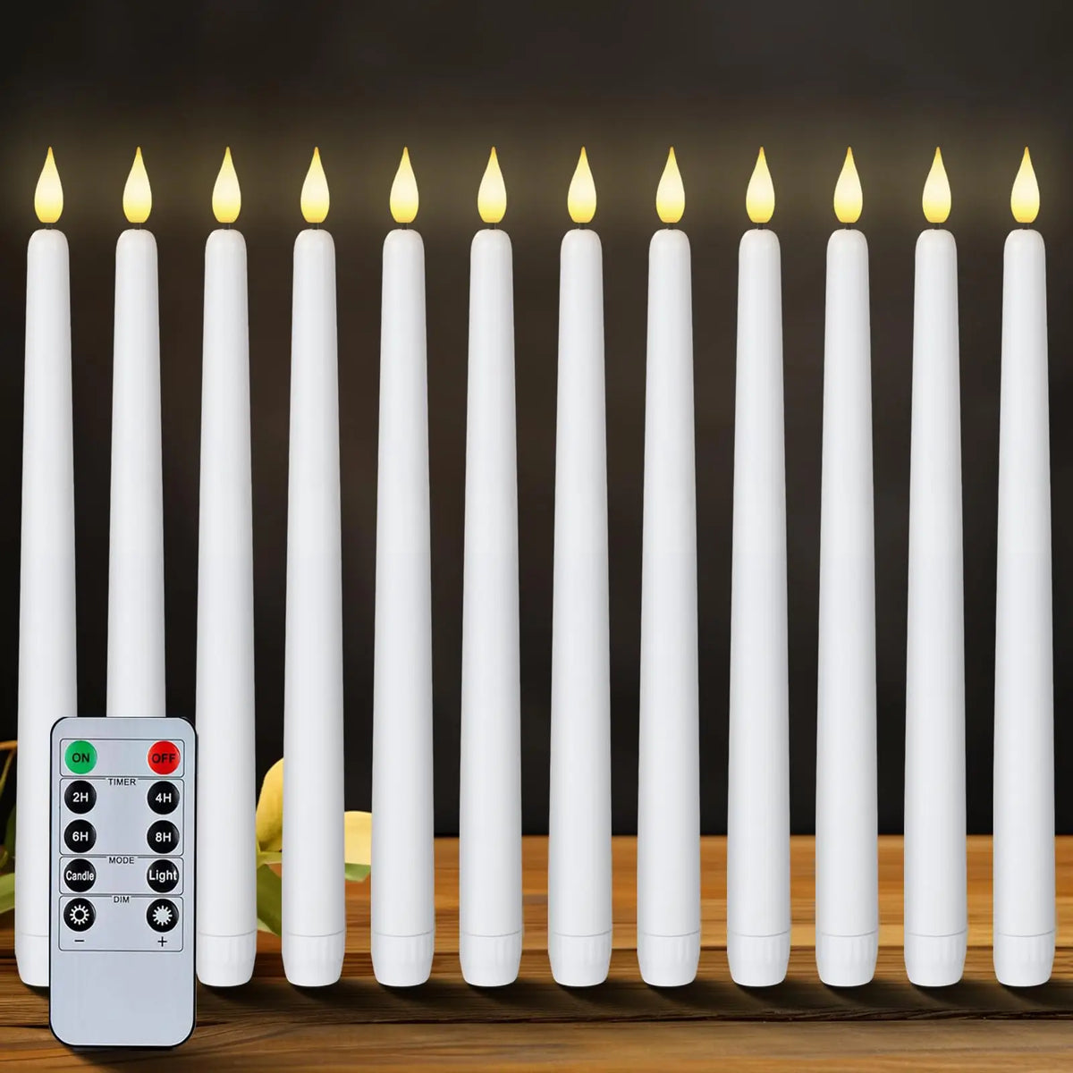 A set of white flameless LED taper candles standing in a row next to a remote control.