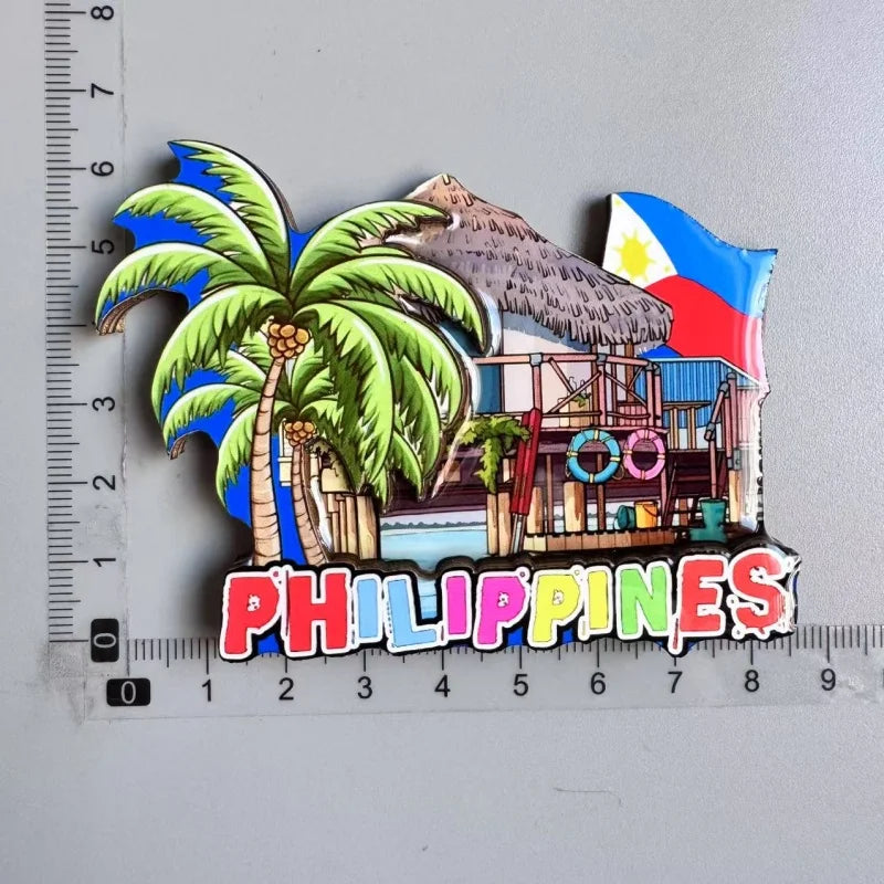 A collection of wooden fridge magnets featuring tropical scenes and the Philippines flag.