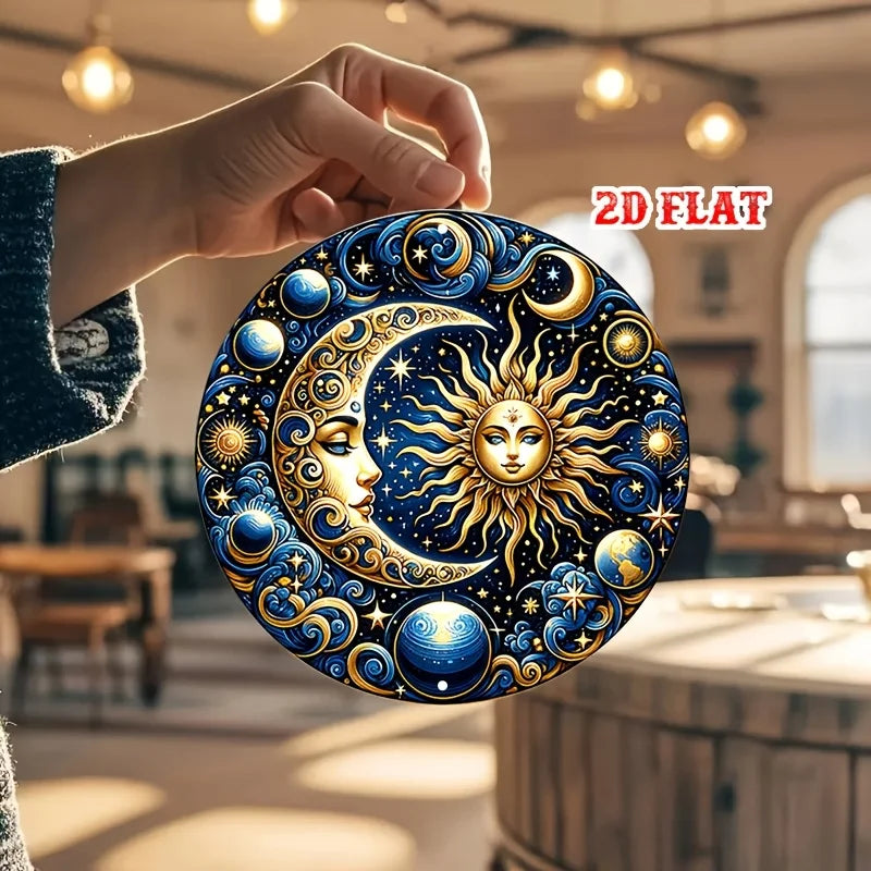 A hand holds a round metal wall sign featuring a detailed golden sun and crescent moon against a deep blue celestial backgrou