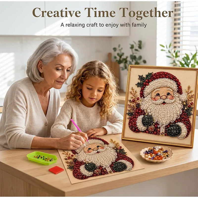 An elderly woman and a child are painting a Christmas scene with pearls on canvas inside a gold frame.