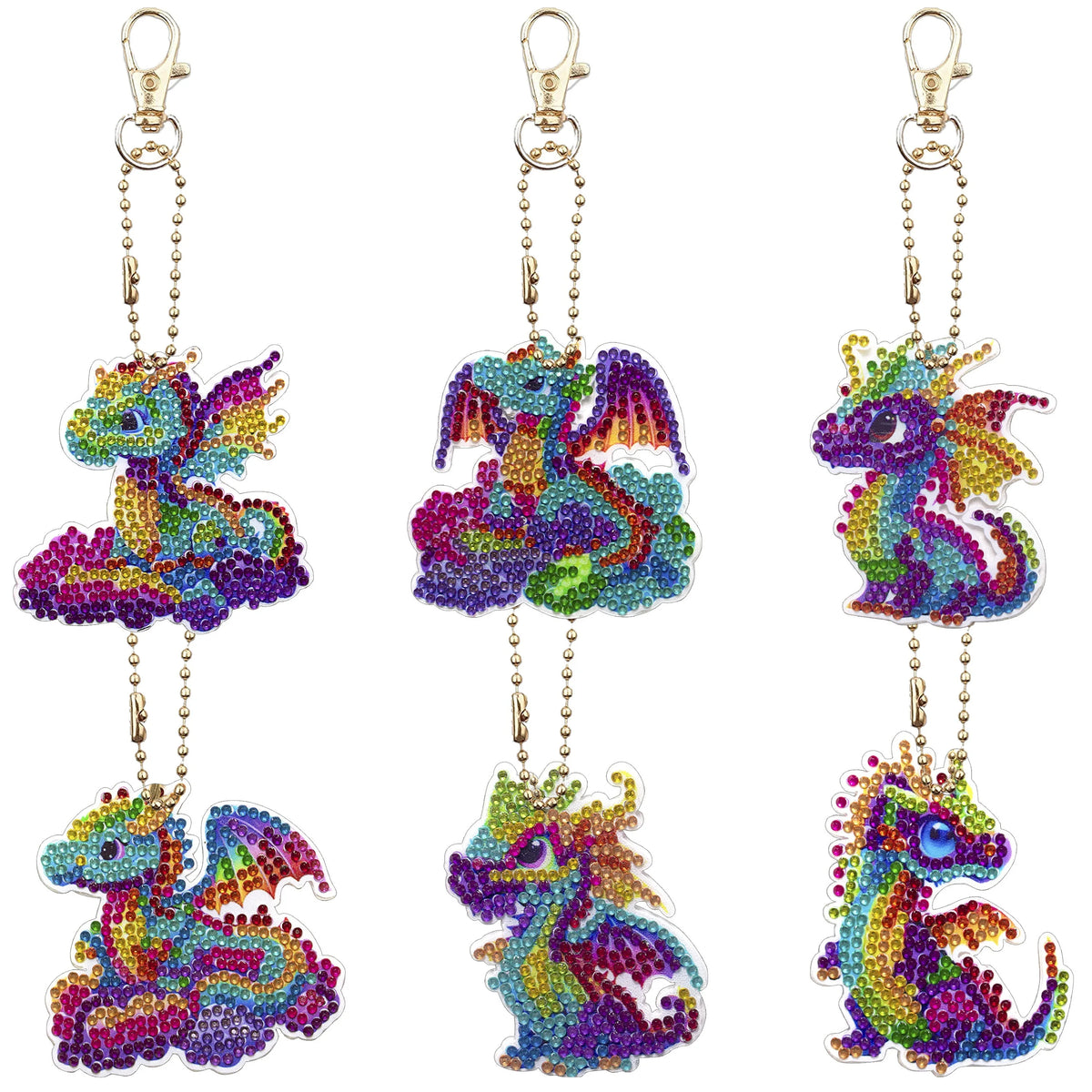 A set of colorful DIY diamond painting keychains featuring vibrant purple, green, and blue dragon designs.