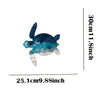 A rustic iron wall art sculpture of a sea turtle with blue and green scales.