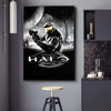 A canvas art print featuring a soldier in tactical gear aiming a weapon against a large moon, titled Halo Anniversary.