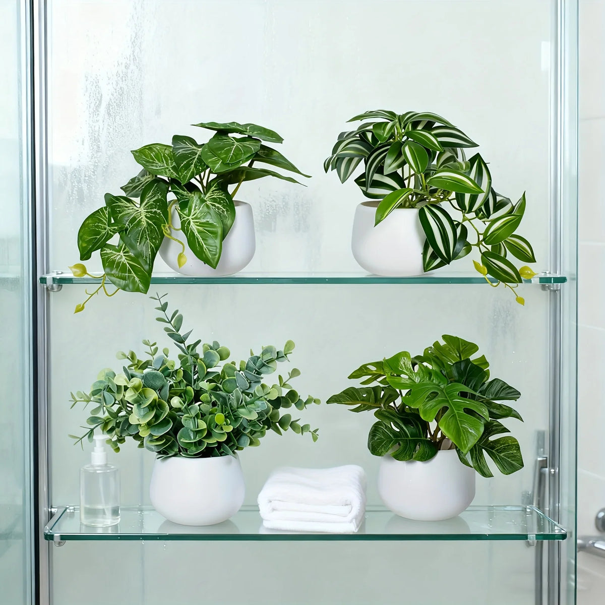 A glass cabinet displaying various artificial bonsai succulent plants in white pots.