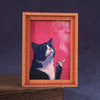 A framed watercolor painting of a black and white cat smoking a cigarette.
