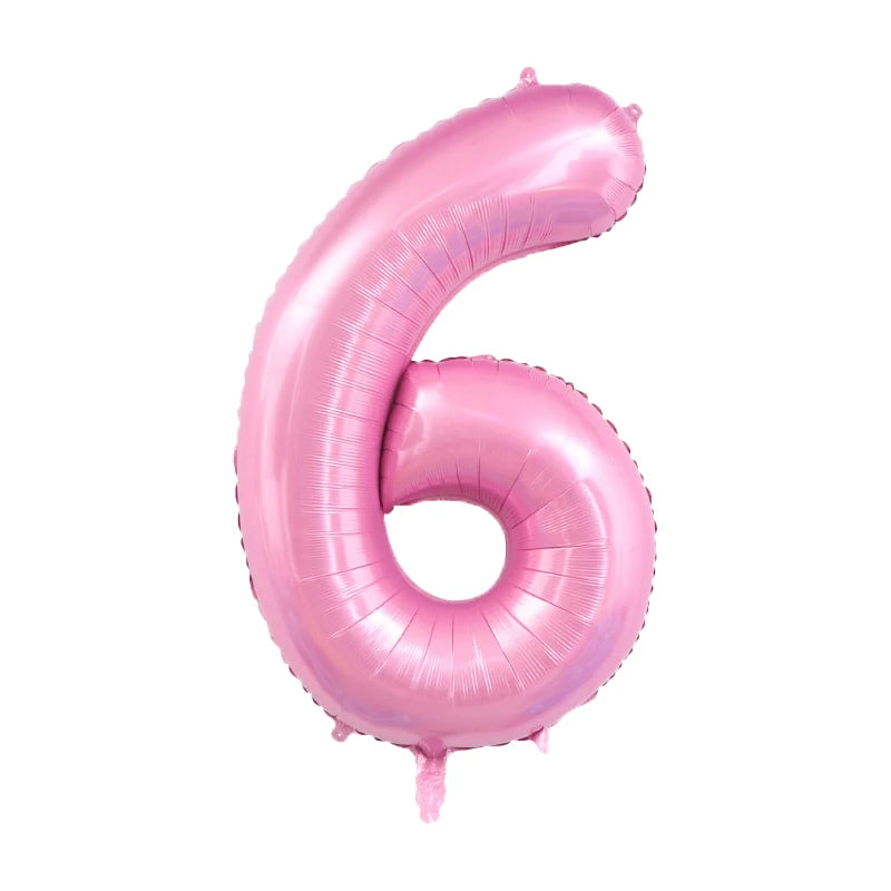 A pink foil number balloon shaped like the number six.