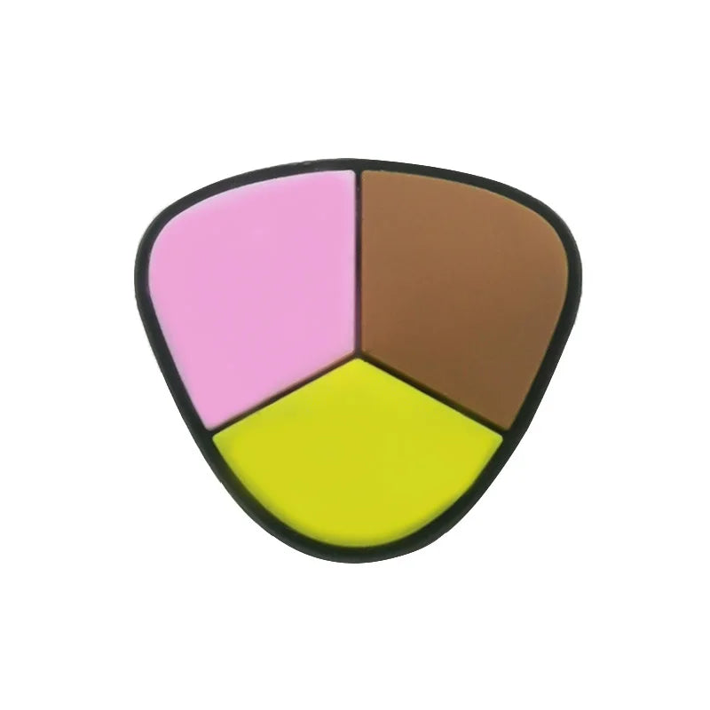 A set of five colored PVC shoe charms including pink, brown, and yellow shapes.